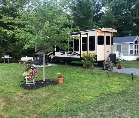 rv parked next to grassy area