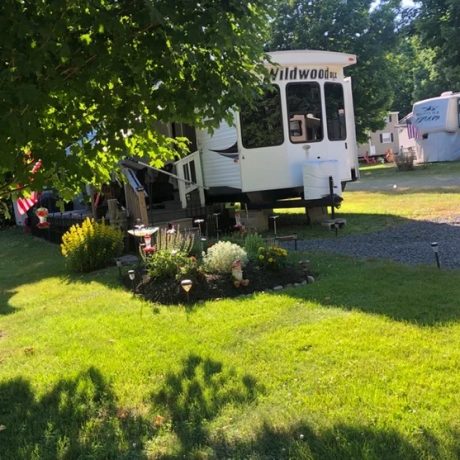 rv parked next to grass